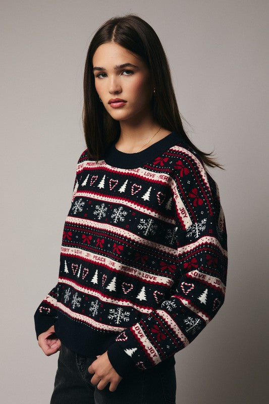 Woman wearing cute patterned Christmas sweater