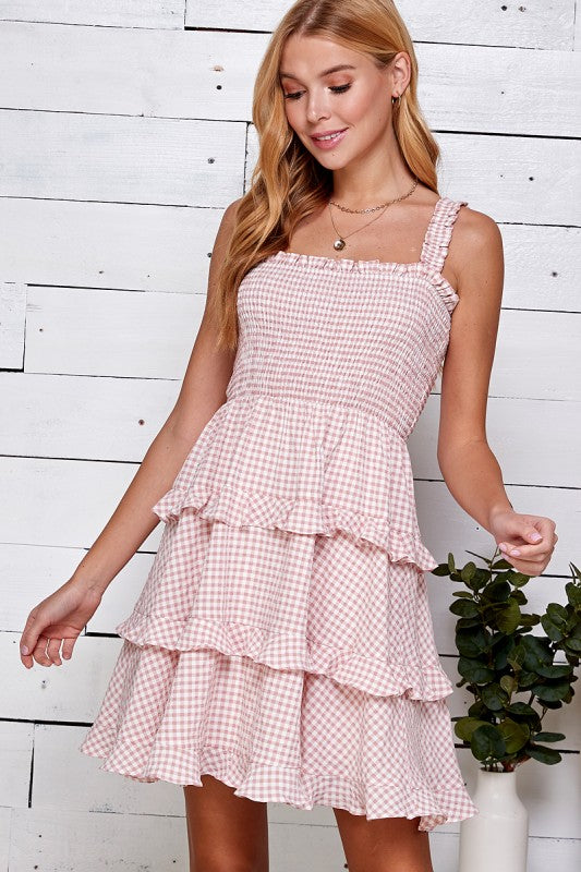 Woman wearing a pink gingham dress