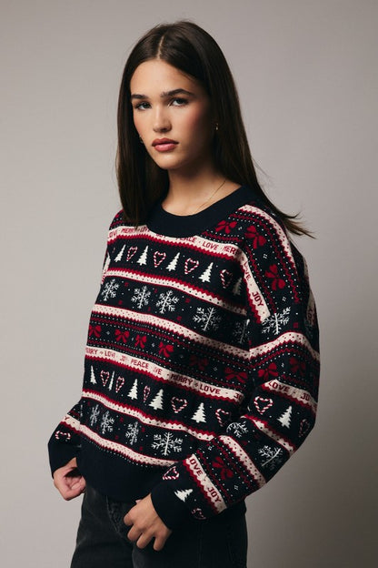 Woman wearing cute patterned Christmas sweater 