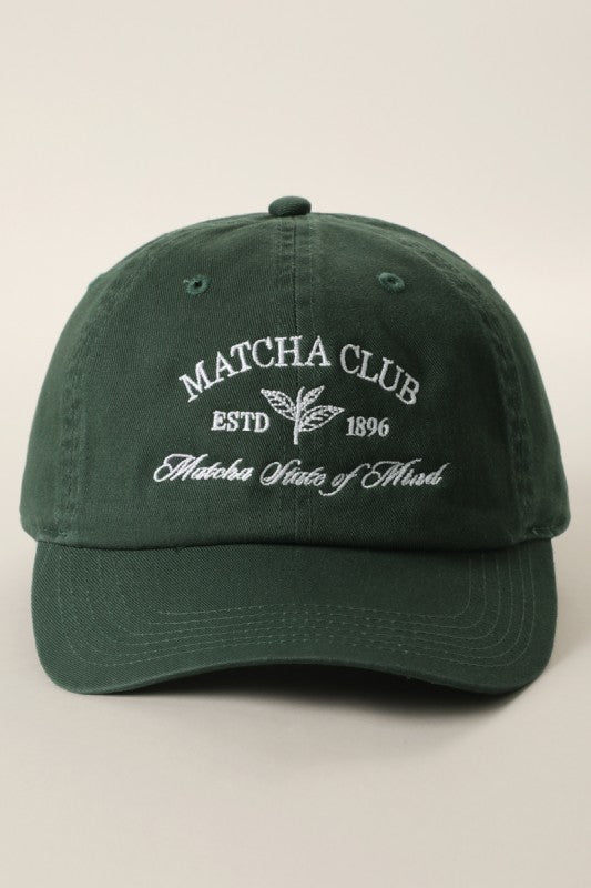 Green cap with 'Matcha Club' text on a beige background